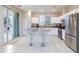 Modern kitchen with stainless steel appliances, granite countertops, and white cabinetry at 3043 Jacaranda Dr, Las Vegas, NV 89117