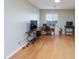 Bright living room with hardwood floors and multiple windows, perfect for a home office setup at 3043 Jacaranda Dr, Las Vegas, NV 89117