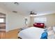 Expansive main bedroom with natural light, ceiling fan, and a lounge area with a plush couch at 3043 Jacaranda Dr, Las Vegas, NV 89117