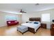 Spacious main bedroom features a seating area, ceiling fan, and windows for natural light at 3043 Jacaranda Dr, Las Vegas, NV 89117