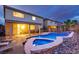 A backyard pool with stone surround is a relaxing oasis with lounge chairs and a covered patio at 3043 Jacaranda Dr, Las Vegas, NV 89117