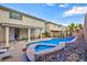 Spacious backyard with a refreshing pool and lush landscaping, ideal for relaxation and outdoor entertaining at 3043 Jacaranda Dr, Las Vegas, NV 89117