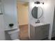 Modern bathroom features a granite vanity and walk-in shower with tile surround at 310 E Lake Mead Blvd, North Las Vegas, NV 89030