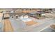 An aerial view of new home construction with spacious front yard and long driveway at 3120 S Torrey Pines Ave, Pahrump, NV 89048