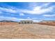 Wide shot of the large backyard with new construction, fenced for privacy, and ready for landscaping at 3120 S Torrey Pines Ave, Pahrump, NV 89048