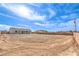 Spacious backyard features fresh dirt, a cinder block fence, and views of the surrounding neighborhood at 3120 S Torrey Pines Ave, Pahrump, NV 89048