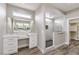 Bathroom featuring a large vanity, tiled shower and large mirror at 3120 S Torrey Pines Ave, Pahrump, NV 89048