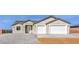 Charming single-story home featuring a two-car garage, gravel landscaping, and stucco siding at 3120 S Torrey Pines Ave, Pahrump, NV 89048