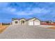 Inviting single-story home with a two-car garage, neutral exterior, and xeriscaped front yard for water conservation at 3120 S Torrey Pines Ave, Pahrump, NV 89048