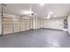 Spacious garage with three car capacity and painted floor provides ample room for vehicles and storage at 3120 S Torrey Pines Ave, Pahrump, NV 89048