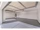A large, bright garage with epoxy flooring providing substantial space for vehicles and storage at 3120 S Torrey Pines Ave, Pahrump, NV 89048