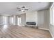 Open-concept living room with fireplace and new flooring at 3120 S Torrey Pines Ave, Pahrump, NV 89048