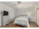 Well-lit bedroom with wood floors and closet space, furnished with modern decor at 344 Mill Hollow Rd, Las Vegas, NV 89107