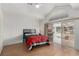 Bedroom features a sliding glass door to backyard and vaulted ceilings at 344 Mill Hollow Rd, Las Vegas, NV 89107