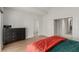 Bedroom features a neutral color scheme, dresser, and closet at 344 Mill Hollow Rd, Las Vegas, NV 89107