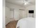 A bright bedroom with wood floors with attached closet and doorway at 344 Mill Hollow Rd, Las Vegas, NV 89107