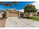 Single-story house with a two-car garage, set in a well-maintained neighborhood at 344 Mill Hollow Rd, Las Vegas, NV 89107