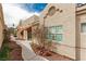 Charming single-story house exterior with a sidewalk and desert-style landscaping at 344 Mill Hollow Rd, Las Vegas, NV 89107