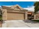 Inviting single-story house featuring a two-car garage and well-kept landscaping at 344 Mill Hollow Rd, Las Vegas, NV 89107