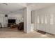 Inviting foyer leading into a spacious living room with built-in shelves and entertainment center at 344 Mill Hollow Rd, Las Vegas, NV 89107