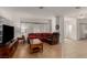Cozy living room with hardwood floors, comfortable seating, and a large window for natural light at 344 Mill Hollow Rd, Las Vegas, NV 89107