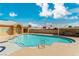 Large community swimming pool with sunning deck and lounge chairs at 344 Mill Hollow Rd, Las Vegas, NV 89107