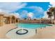 Community pool with fountain feature, ample deck space, and privacy wall at 344 Mill Hollow Rd, Las Vegas, NV 89107