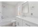 Bathroom with white marble tile in shower, white cabinets, and modern fixtures at 3540 Estes Park Dr, Las Vegas, NV 89122