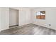 Bedroom featuring wood-style floors, closet with sliding doors, and a window at 3540 Estes Park Dr, Las Vegas, NV 89122