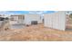 Exterior view of the house with a shed and a covered carport, perfect for outdoor activities and parking at 3540 Estes Park Dr, Las Vegas, NV 89122