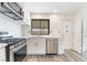 Bright kitchen with stainless steel oven, updated cabinets, and modern countertop at 3540 Estes Park Dr, Las Vegas, NV 89122