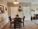Neutral dining area featuring tile flooring, a wood table with seating, and bright natural light at 3550 Bay Sands Dr # 3077, Laughlin, NV 89029