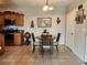 Cozy dining area features tile floors, a round wood table with four chairs, and neutral wall colors at 3550 Bay Sands Dr # 3077, Laughlin, NV 89029