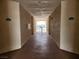 Bright hallway with unit numbers, offering a clear path with scenic views beyond the gate at 3550 Bay Sands Dr # 3077, Laughlin, NV 89029