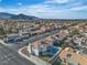 An aerial view of the neighborhood showcasing the rooftops and surrounding streets and a mountain view at 3604 N Campbell Rd, Las Vegas, NV 89129