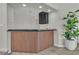 Unique bar area featuring a slatted wood exterior, sleek countertop, and ample lighting at 3604 N Campbell Rd, Las Vegas, NV 89129