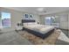 Bedroom with a blue bed frame, light gray carpet, and natural light from a window at 3604 N Campbell Rd, Las Vegas, NV 89129