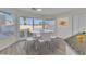 Cozy breakfast nook with bright windows, a modern table setting, and view of the backyard at 3604 N Campbell Rd, Las Vegas, NV 89129