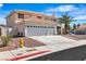 Lovely two-story home with a spacious driveway, three-car garage, and mature palm tree in the front yard at 3604 N Campbell Rd, Las Vegas, NV 89129