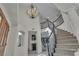 Bright foyer with a winding staircase, high ceilings, and stylish light fixture at 3604 N Campbell Rd, Las Vegas, NV 89129