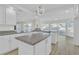 Spacious kitchen with white cabinets, granite countertops, a central island, and hardwood flooring at 3604 N Campbell Rd, Las Vegas, NV 89129