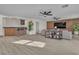 Inviting living room with modern wood paneling, recessed lighting, three ceiling fans and comfortable seating area at 3604 N Campbell Rd, Las Vegas, NV 89129