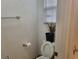 Clean bathroom with white fixtures, including a toilet and a vanity with a sink at 3616 Rose Canyon Dr, North Las Vegas, NV 89032