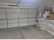 Attached garage with a white door and storage space at 3616 Rose Canyon Dr, North Las Vegas, NV 89032