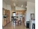 Bright and airy kitchen featuring wood cabinets and an adjacent dining area with backyard access at 3616 Rose Canyon Dr, North Las Vegas, NV 89032