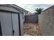 The side yard features a shed and block wall fencing at 3616 Rose Canyon Dr, North Las Vegas, NV 89032