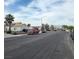 Street view of the neighborhood showcasing well-maintained homes and a clear blue sky at 3616 Rose Canyon Dr, North Las Vegas, NV 89032
