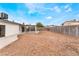 Expansive backyard featuring a blank canvas with gravel landscaping and a covered patio area, perfect for creating an outdoor oasis at 3915 Delling Ct, Las Vegas, NV 89104