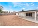 Expansive backyard with the home and covered patio, perfect for outdoor activities at 3915 Delling Ct, Las Vegas, NV 89104