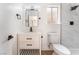 Bright bathroom featuring a white vanity, matte black hardware and walk-in shower at 3915 Delling Ct, Las Vegas, NV 89104
